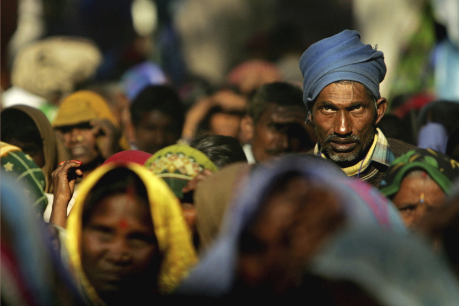 FILE - Members of the audience listen to a speaker at a rally organized by National Conference of Dalit Organisations in New Delhi, India, Sunday, Dec. 5, 2005. Dalits, who belong to the lowest of castes according to the Indian caste system, came from different parts of India to participate in a rally to mark World Dignity Day. Caste is an ancient system of social hierarchy based on one's birth that is tied to concepts of purity and social status. While the definition of caste has evolved over the centuries, under Muslim and British rule, the suffering of those at the bottom of the caste pyramid - known as Dalits, which in Sanskrit means broken -- has continued.