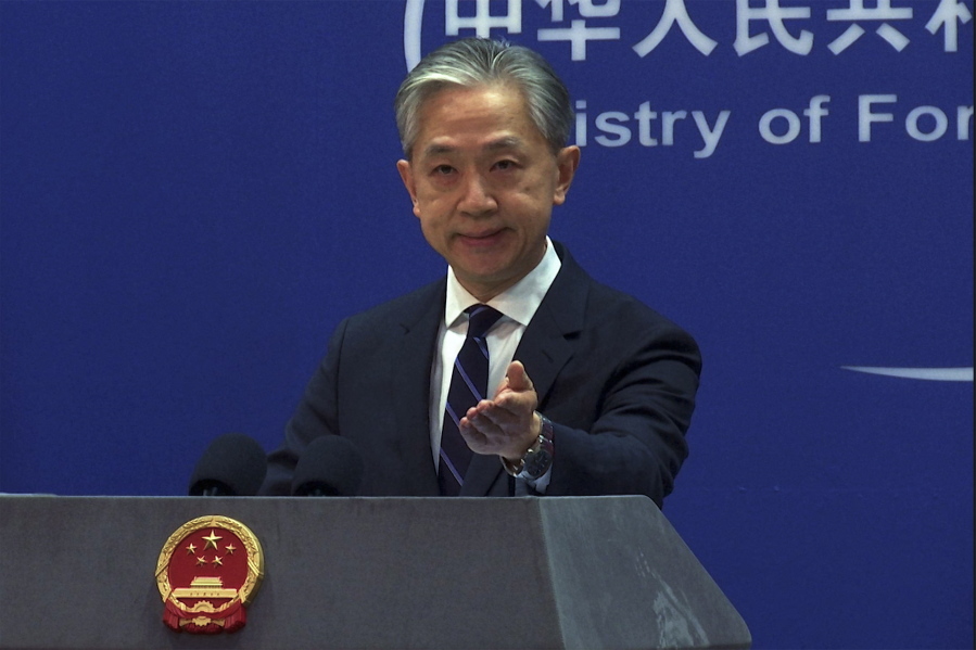 In this image made from video, Chinese Foreign Ministry spokesperson Wang Wenbin gestures as he speaks during a media briefing at the Ministry of Foreign Affairs office in Beijing, Monday, Feb. 13, 2023. China on Monday said more than 10 U.S. high-altitude balloons have flown in its airspace during the past year without its permission, following Washington's accusation that Beijing operates a fleet of surveillance balloons around the world.
