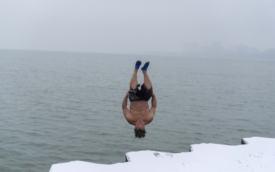 "The Great Lake Jumper" Dan O'Conor takes a plunge into the frigid waters of Lake Michigan, as he does every morning, Thursday, Jan. 26, 2023, in Chicago. O'Conor has jumped every day since June 2020.