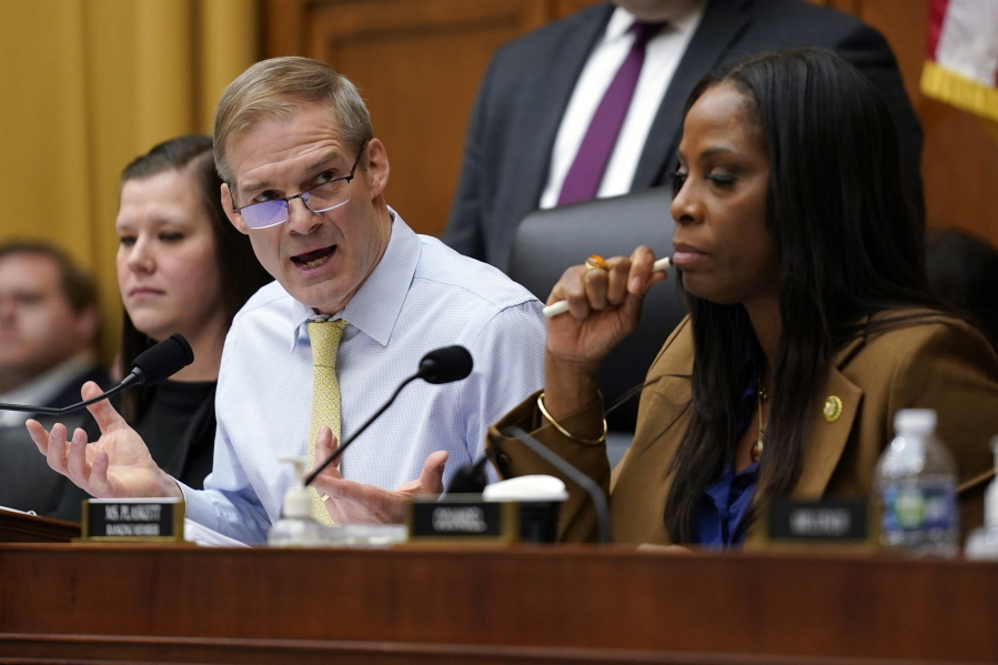 Chairman Jim Jordan, R-Ohio, left, speaks as Del. Stacey Plaskett, D-Virgin Islands, the ranking member, right, listens, during a House Judiciary subcommittee hearing on what Republicans say is the politicization of the FBI and Justice Department and attacks on American civil liberties on Capitol Hill, Thursday, Feb. 9, 2023, in Washington.