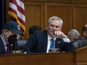 House Oversight and Accountability Committee Chairman James Comer, R-Ky., center, joined by Rep. Jamie Raskin, D-Md., left, the ranking member, leads a hearing on fraud and waste in the COVID-19 relief programs, at the Capitol in Washington, Wednesday, Feb. 1, 2023. (AP Photo/J.