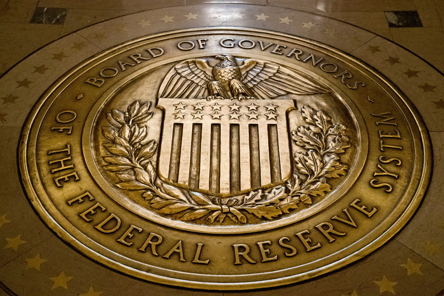 FILE- In this Feb. 5, 2018, file photo, the seal of the Board of Governors of the United States Federal Reserve System is displayed in the ground at the Marriner S. Eccles Federal Reserve Board Building in Washington.Richmond Federal Reserve President Thomas Barkin on Friday, Feb. 17, 2023 downplayed recent signs that the economy is strengthening, but also said he is prepared to keep raising interest rates in smaller increments as often as needed to quell inflation.