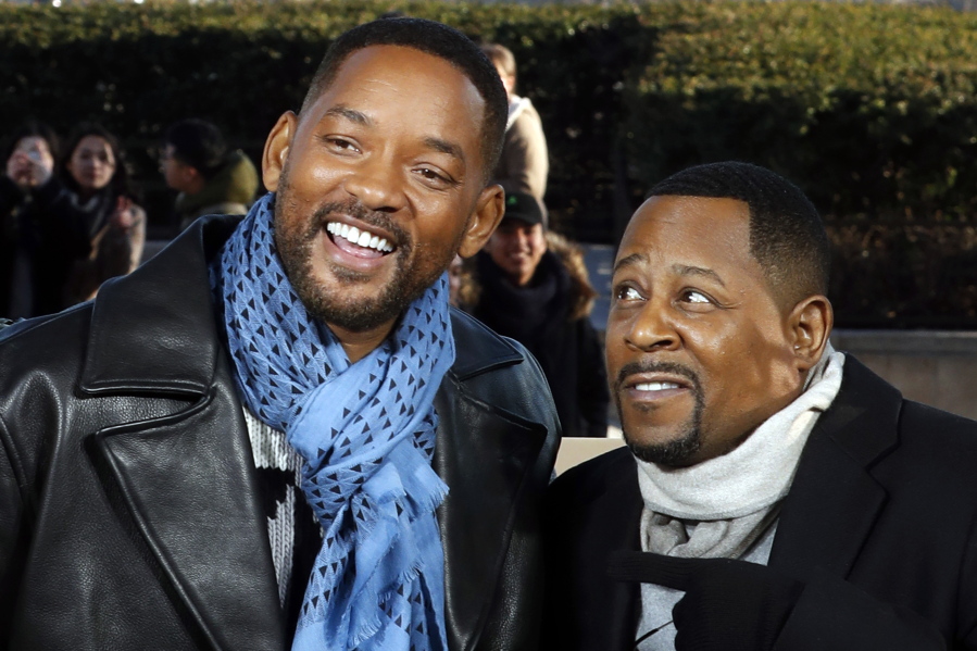FILE - Co-stars Will Smith, left, and Martin Lawrence appear at a photo call for their film "Bad Boys for Life", in Paris on Jan. 6, 2020. Smith and Lawrence are teaming up for a fourth "Bad Boys" movie, in one of Smith's most high-profile new projects since he slapped Chris Rock at the Oscars. Sony Pictures announced Tuesday that the untitled "Bad Boys" sequel is in early pre-production.
