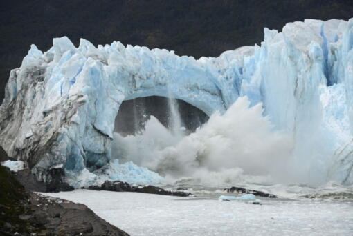 FILE - Chunks of ice break off the Perito Moreno Glacier, in Lake Argentina, at Los Glaciares National Park, near El Calafate, in Argentina's Patagonia region, March 10, 2016. As glaciers melt and pour massive amounts of water into nearby lakes, 15 million people across the globe live under the threat of a sudden and deadly outburst flood, a new study finds.