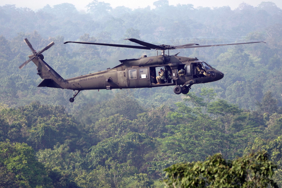 FILE - A U.S. Army Black Hawk helicopter flies during Super Garuda Shield 2022 joint military exercises in Baturaja, South Sumatra, Indonesia, Aug. 12, 2022. A Black Hawk helicopter from the Tennessee National Guard crashed Wednesday, Feb. 15, 2023, in Alabama, killing everyone on board, a spokesman for the Madison County sheriff's office says.
