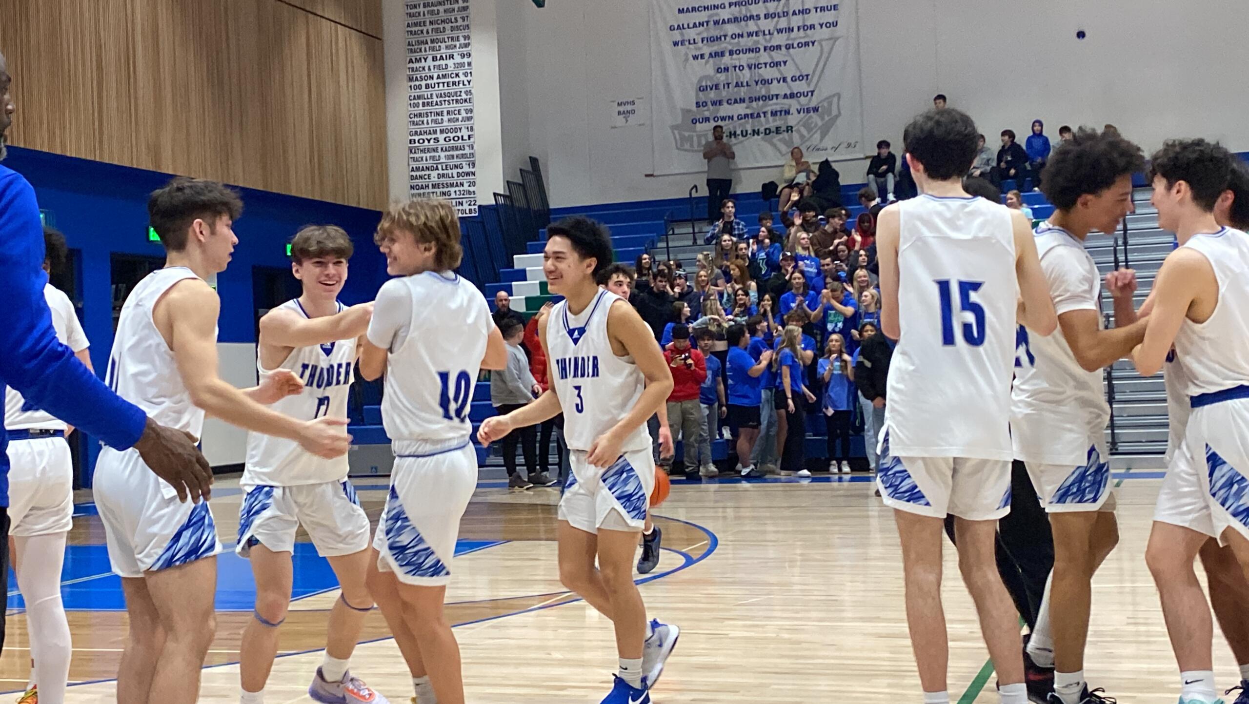 Mountain View players celebrate their 61-55 victory Saturday over Todd Beamer out of Federal Way. It's the program's first regional berth since the 2011-12 season.
