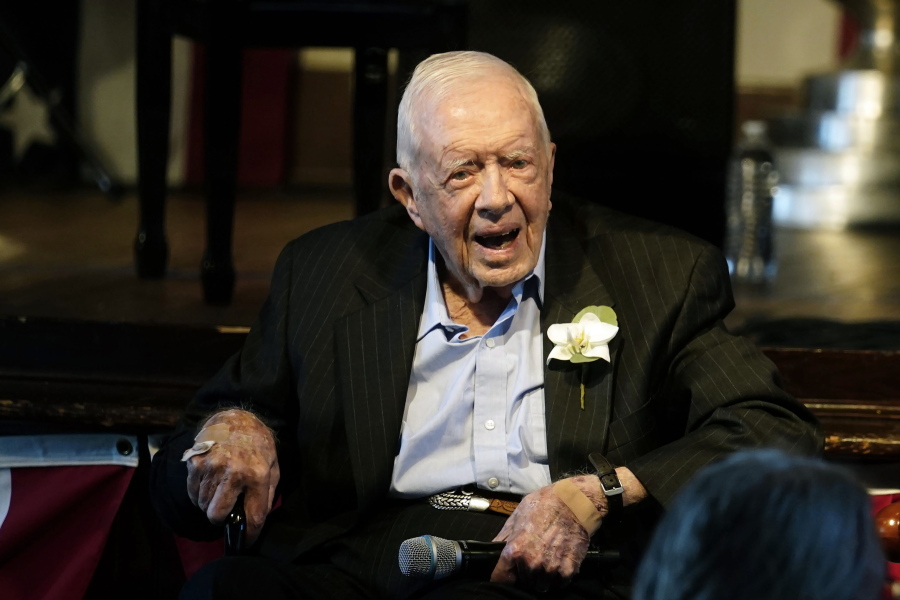 FILE - Former President Jimmy Carter reacts as his wife Rosalynn Carter speaks during a reception to celebrate their 75th wedding anniversary, July 10, 2021, in Plains, Ga. The Carter Center said Saturday, Feb. 18, 2023, that former President Jimmy Carter has entered home hospice care.