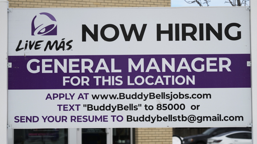 A hiring sign is displayed outside of a restaurant in Arlington Heights, Ill., Monday, Jan. 30, 2023. On Wednesday, the Labor Department reports on job openings and labor turnover for December. (AP Photo/Nam Y.