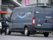 An Amazon Prime driver makes a delivery in Pittsburgh on Monday, Jan. 23, 2023. On Wednesday, the Labor Department reports on job openings and labor turnover for December. (AP Photo/Gene J.