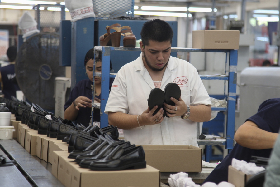 People work in a shoe maquiladora or factory in Leon, Mexico, Monday, Feb. 7, 2023. t has been nearly two years since the United States began pressing Mexico over labor rights violations, by using rapid dispute resolution methods (RRM) contained in the U.S.-Mexico Canada free trade agreement.