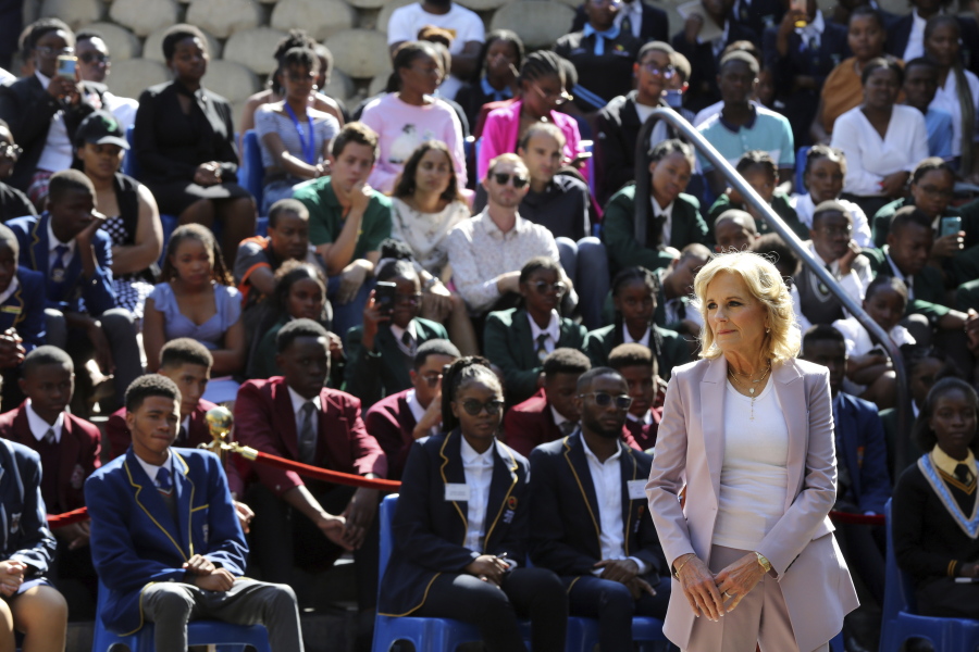 U.S. First lady Jill Biden, right, greets students while on a visit to the University of Science and Technology in Windhoek, Namibia Friday, Feb. 24, 2023. Biden told the young people that the democracy their parents and grandparents fought for is now theirs to defend and protect.