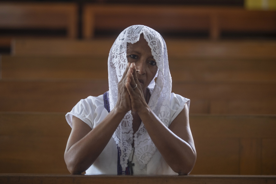 A Catholic woman attends Sunday's mass at the Metropolitan Cathedral in Managua, Nicaragua, Sunday, Feb. 12, 2023. Pope Francis expressed sadness and worry at the news that Bishop Roland Alvarez, an outspoken critic of the Nicaraguan government, had been sentenced to 26 years in prison.