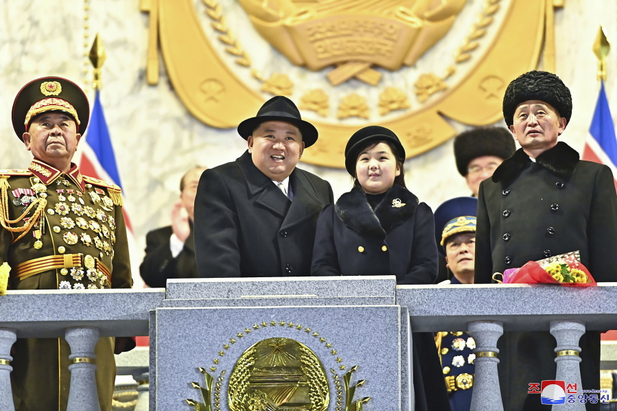 In this photo provided by the North Korean government, North Korean leader Kim Jong Un, center left, with his daughter attends a military parade to mark the 75th founding anniversary of the Korean People's Army on Kim Il Sung Square in Pyongyang, North Korea Wednesday, Feb. 8, 2023. Independent journalists were not given access to cover the event depicted in this image distributed by the North Korean government. The content of this image is as provided and cannot be independently verified. Korean language watermark on image as provided by source reads: "KCNA" which is the abbreviation for Korean Central News Agency.