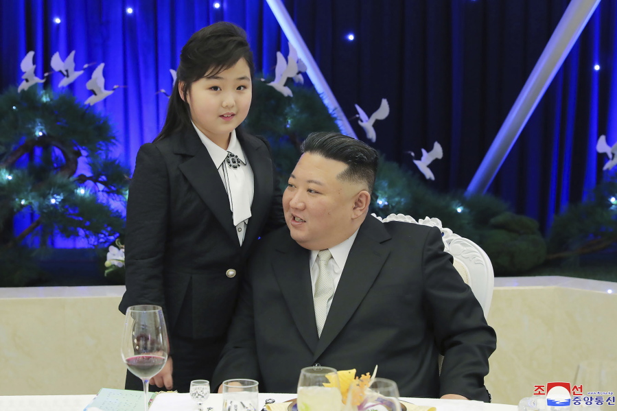 In this photo provided by the North Korean government, North Korean leader Kim Jong Un and his daughter attend a feast to mark the 75th founding anniversary of the Korean People's Army at an unspecified place in North Korea Tuesday, Feb. 7, 2023. Independent journalists were not given access to cover the event depicted in this image distributed by the North Korean government. The content of this image is as provided and cannot be independently verified. Korean language watermark on image as provided by source reads: "KCNA" which is the abbreviation for Korean Central News Agency.