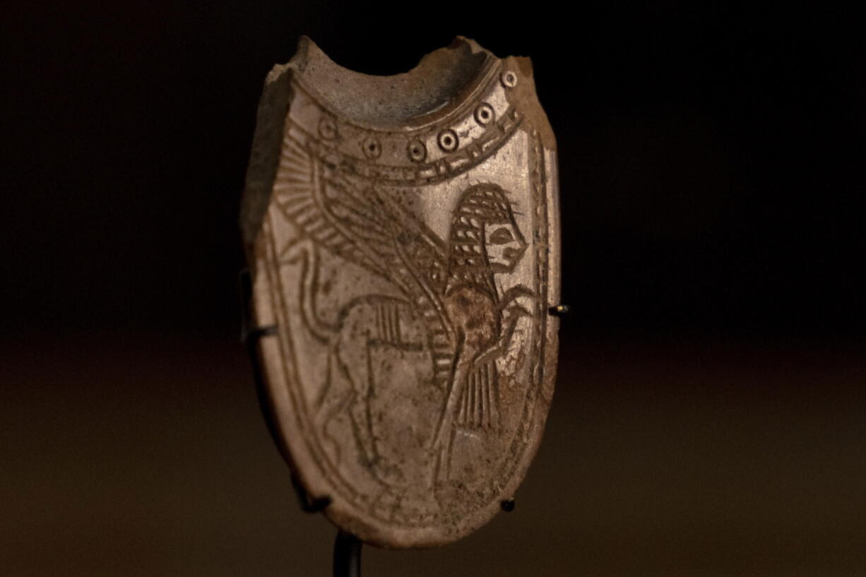 A 2,700-year-old ivory incense spoon plundered from a site in the occupied West Bank -- seized in late 2021 by the Manhattan District Attorney's office as part of a plea deal with billionaire hedge fund manager Michael Steinhardt, displayed at the Palestinian Ministry of Tourism and Antiquities in the West Bank city of Bethlehem, Thursday, Jan. 19, 2023. Earlier this month, American officials handed over the artifact to the Palestinians in what the U.S. State Department's Office of Palestinian Affairs said was "the first event event of such repatriation" by the U.S. to the Palestinians.