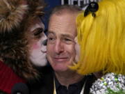Actor Bob Odenkirk is kissed during a a news conference after being honored as Man of the Year by Harvard University's Hasty Pudding Theatricals, Thursday, Feb. 2, 2023, in Cambridge, Mass.