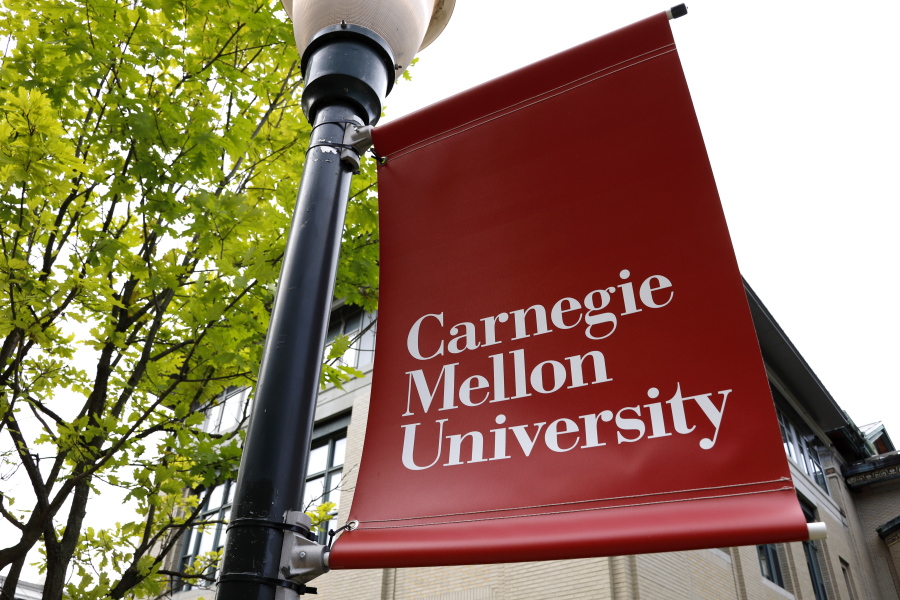 FILE - A Carnegie Mellon University sign is displayed outside Baker Hall on the university's campus in Pittsburgh, June 7, 2019. Carnegie Mellon University and the Norman and Ruth Rales Foundation, named for a home-building supplies entrepreneur and his wife who built their fortune despite early struggles, hope a $150 million initiative will support a new generation of students trying to achieve that American dream. (AP Photo/Gene J.