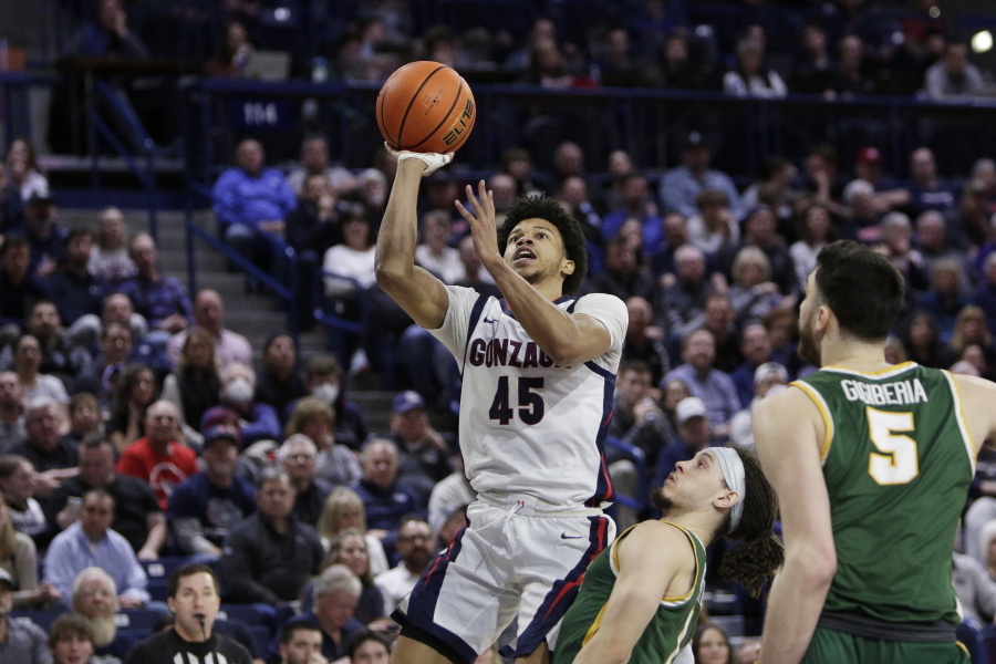 Gonzaga guard Rasir Bolton (45) shoots while defended by San Francisco guard Tyrell Roberts during the second half of an NCAA college basketball game, Thursday, Feb. 9, 2023, in Spokane, Wash.