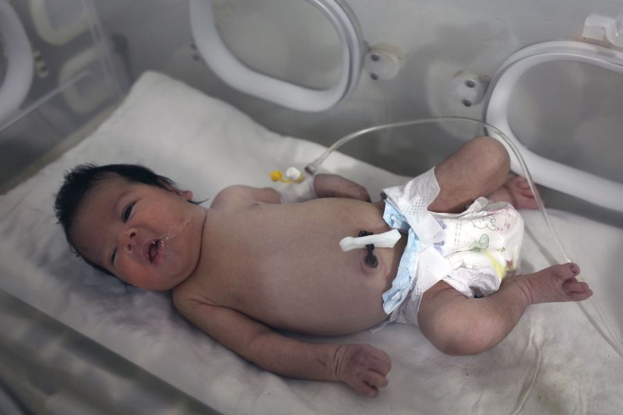 A baby girl who was born under the rubble caused by an earthquake that hit Syria and Turkey receives treatment inside an incubator at a children's hospital in the town of Afrin, Aleppo province, Syria, Thursday, Feb. 9, 2023. The baby girl is the only survivor in her family after her parents and four siblings were killed in Monday's 7.8 magnitude quake that hit southern Turkey and northern Syria. She has been given a name, Aya, Doctor Hani Maarouf who is treating her said Thursday.