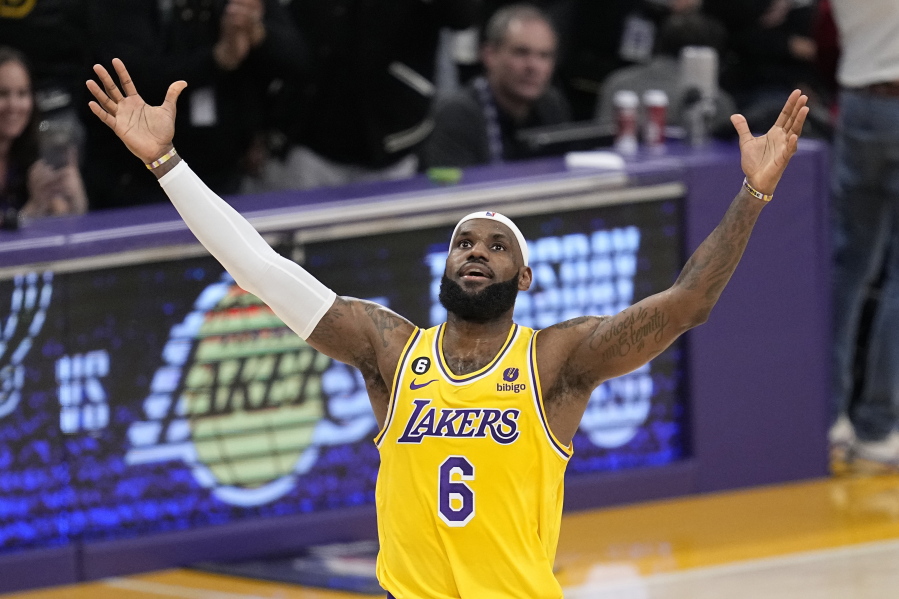 Los Angeles Lakers forward LeBron James celebrates after scoring to pass Kareem Abdul-Jabbar to become the NBA's all-time leading scorer during the second half of an NBA basketball game against the Oklahoma City Thunder Tuesday, Feb. 7, 2023, in Los Angeles. (AP Photo/Mark J.