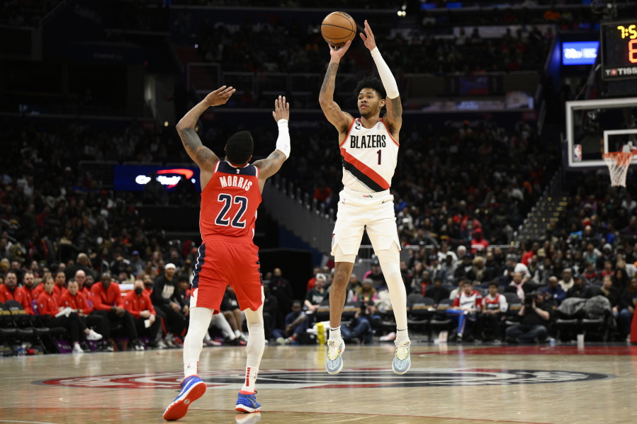Portland Trail Blazers guard Anfernee Simons (1) shoots against Washington Wizards guard Monte Morris (22) during the second half of an NBA basketball game, Friday, Feb. 3, 2023, in Washington. The Trail Blazers won 124-116.