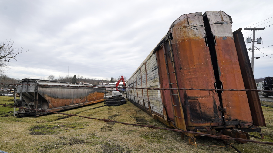 Some of the railcars that derailed Friday night when a Norfolk Southern freight train derailed are in the process of being cleaned up on Thursday, Feb. 9, 2023 in East Palestine, Ohio.(AP Photo/Gene J.