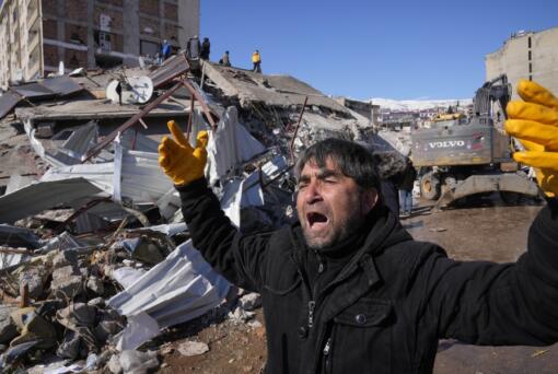A man reacts, after rescue teams found his father dead under a collapsed building, in Kahramanmaras, southern Turkey, Wednesday, Feb. 8, 2023. Nearly two days after the magnitude 7.8 quake struck southeastern Turkey and northern Syria, thinly stretched rescue teams work to pull more people from the rubble of thousands of buildings.