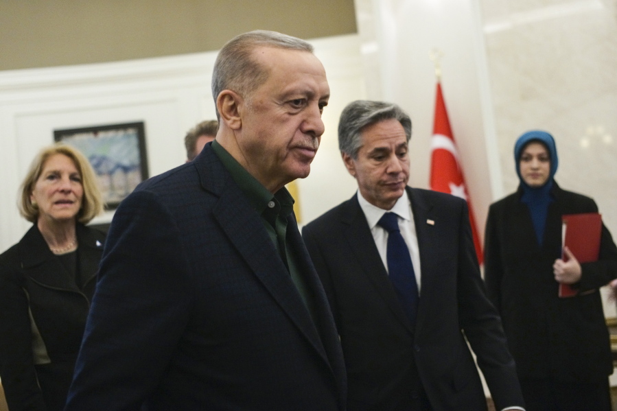 Turkish President Recep Tayyip Erdogan, left, talks to U.S. Secretary of State Antony Blinken during their meeting at Esenboga airport in Ankara, Turkey, Monday, Feb. 20, 2023.