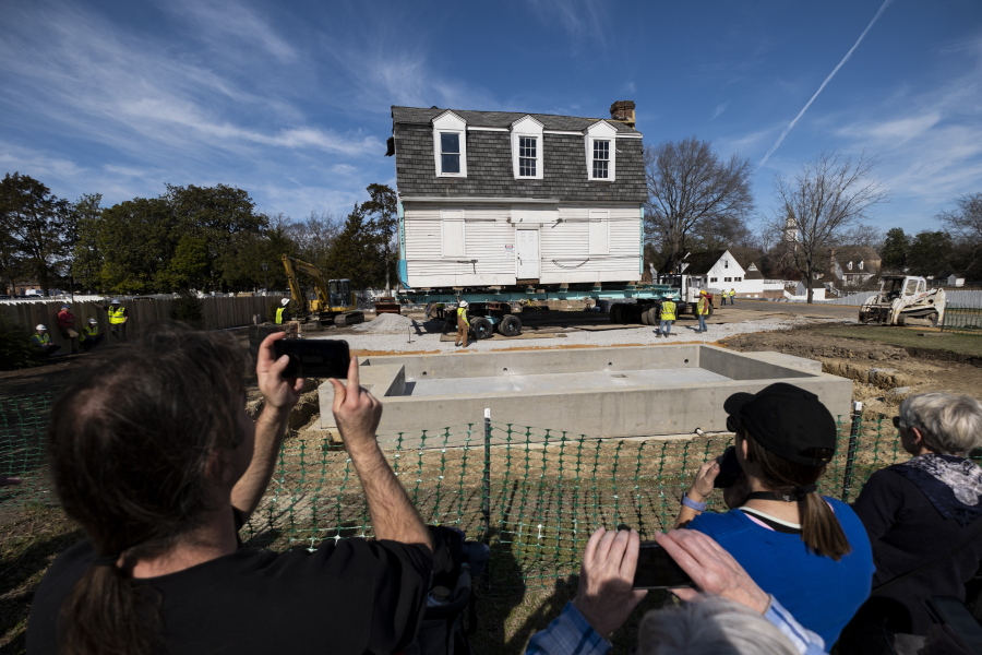 The Bray School is aligned with a set foundation at its new location in Colonial Williamsburg in Williamsburg, Va. on Friday, Feb. 10, 2023 after it was moved from the William & Mary campus.
