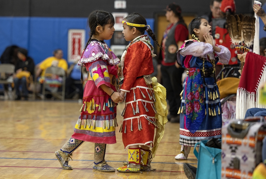 Young girls participate in a Pow Wow to honor the 50th Anniversary of the AIM Warriors of Wounded Knee of 1973 in Rapid City, South Dakota on Saturday, Feb. 25, 2023. The event included a Buffalo Feed.