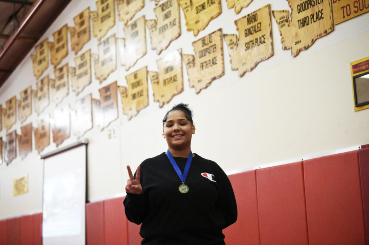 Prairie sophomore Faith Tarrant holds up two fingers for her two state championships in two years of wrestling.