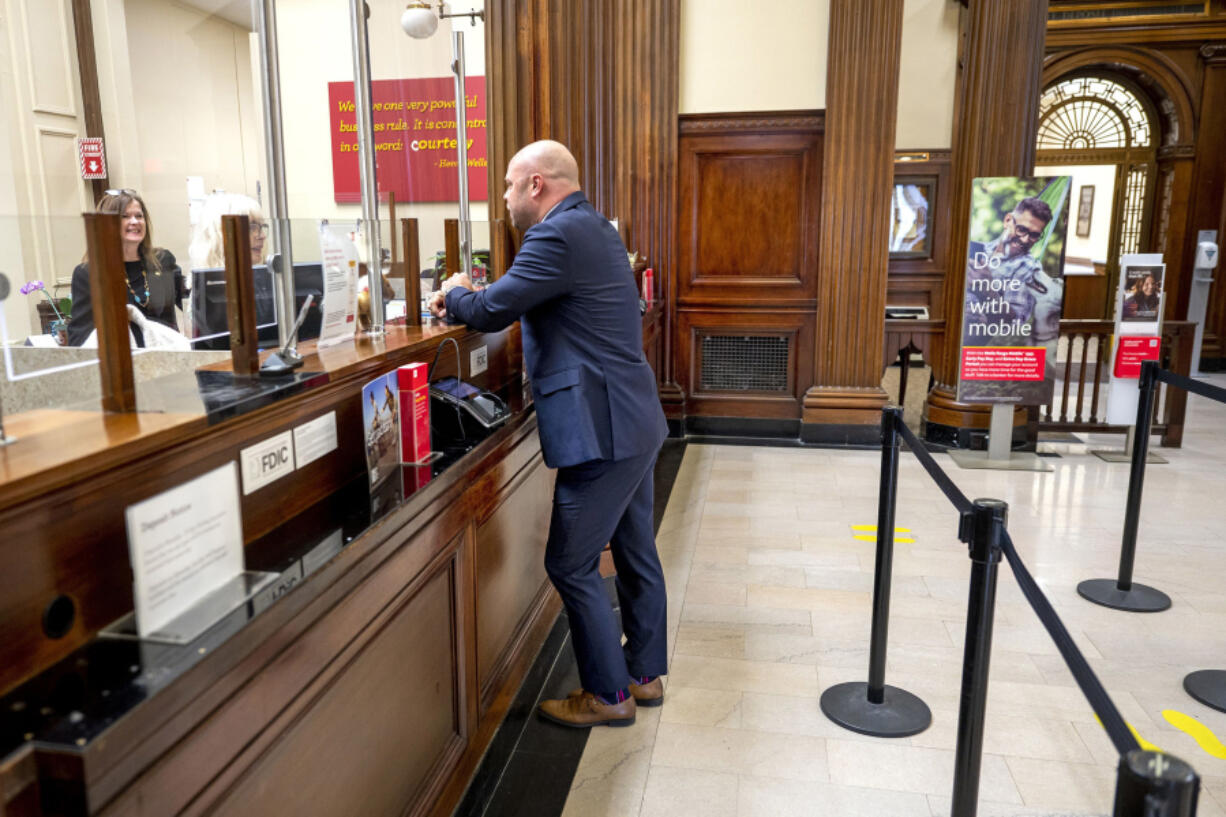 John Zimmerman visits the Wells Fargo bank branch in downtown Moorestown, New Jersey. He started as a part-time teller 23 years ago and now is the regional director, so he knows well how jobs in banking have changed in the past few decades, particularly at bank branches.
