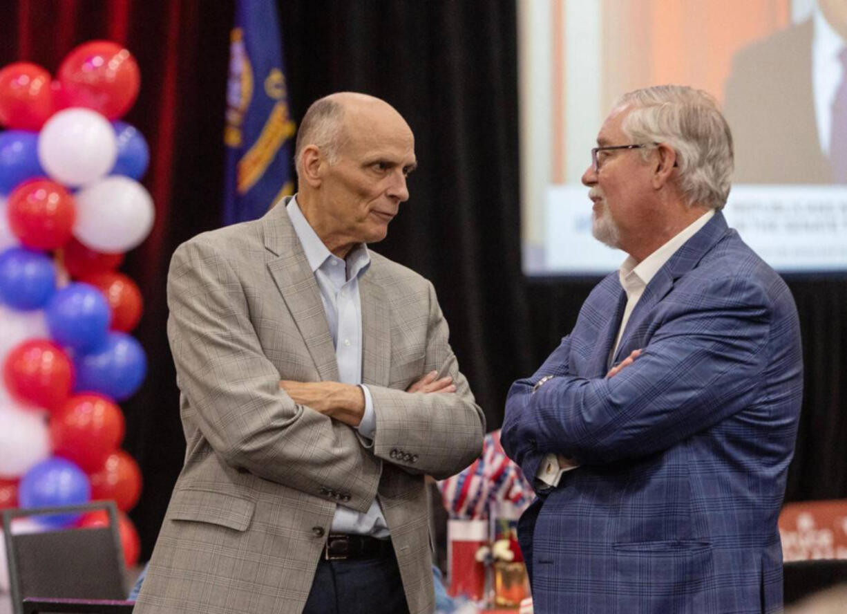 Rep. Bruce Skaug, R-Nampa, right, speaks with Sen. C. Scott Grow, R-Eagle, at a watch party in Boise for Idaho Republican candidates on election night, Nov. 8, 2022. (Sarah A.