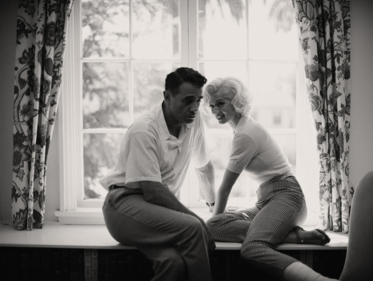 From left, Bobby Cannavale as The Ex-Athlete and Ana de Armas as Marilyn Monroe in "Blonde." (Netflix)