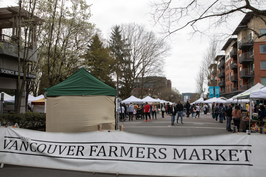 Visitors browse at the Vancouver Farmers Market on Saturday, March 26, 2022.