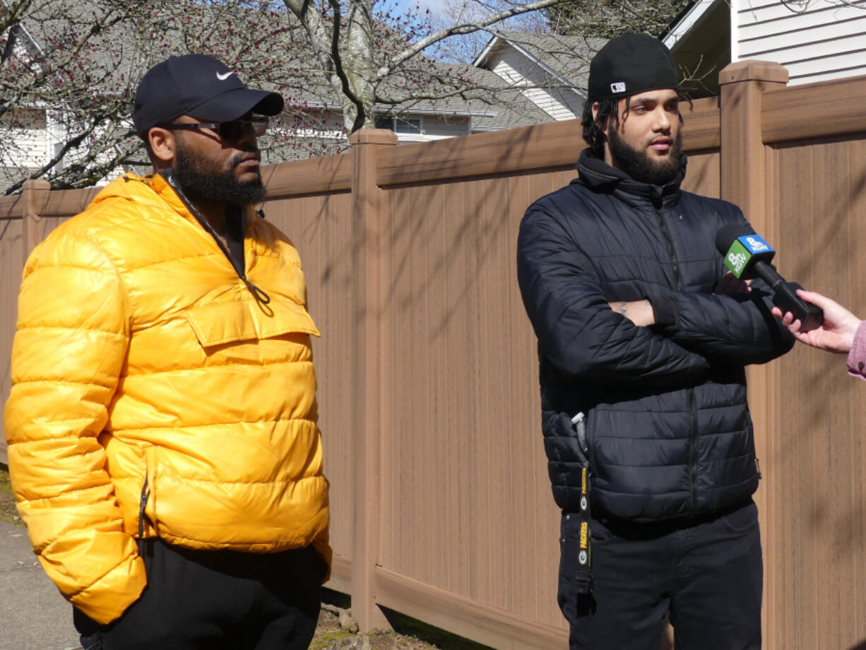 Family members Kendrick Taylor, 38, left, and Miguel Melendez, 24, both of Vancouver, speak with media Tuesday afternoon about missing mother and daughter, Meshay Melendez and Layla Stewart.
