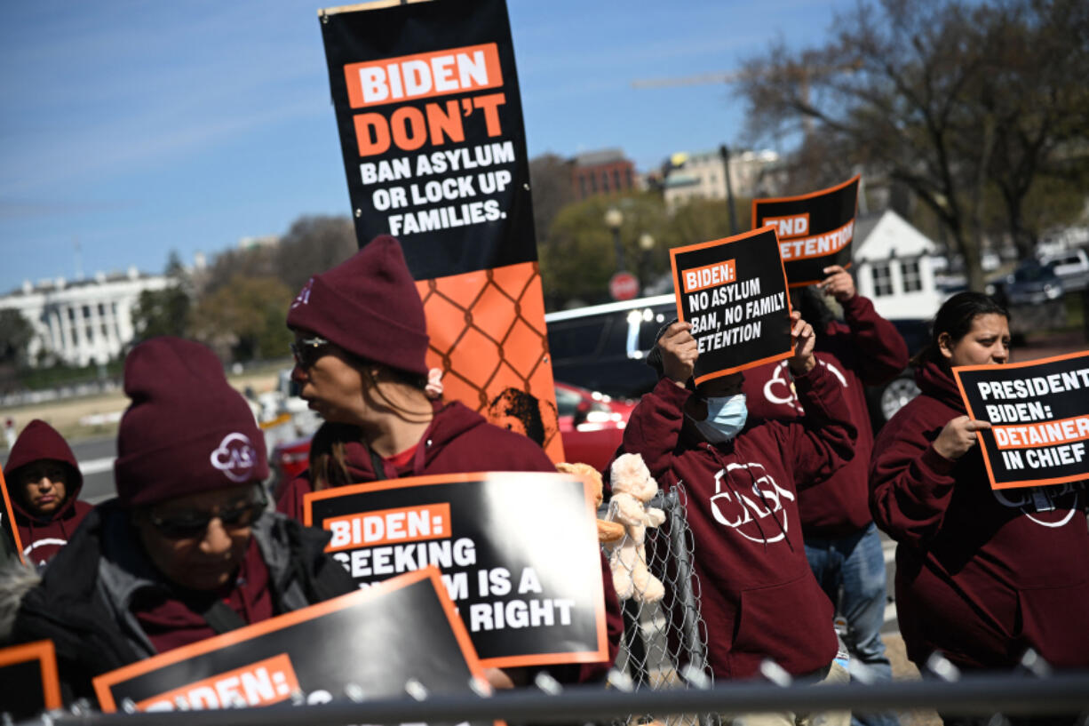 Activists and immigrants rights organizations rally against President Joe Biden's administration asylum policies at the Washington Monument on March 16, 2023, in Washington, D.C.