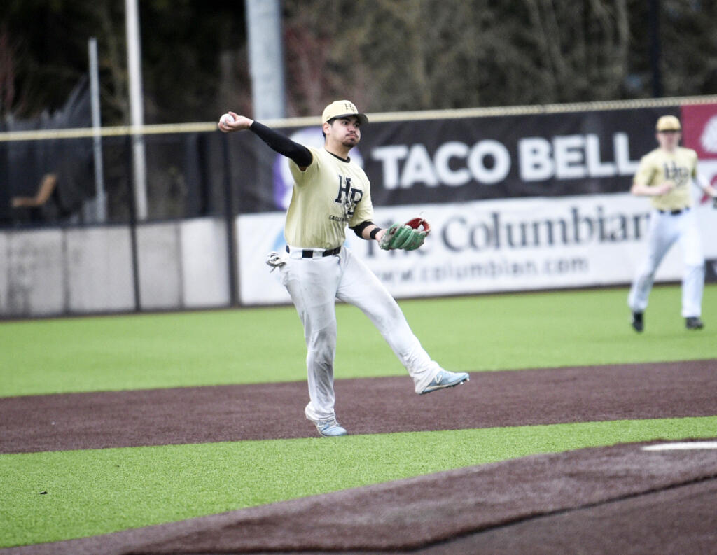 Hudson’s Bay shortstop Elias Estrada makes a throw to first during the Eagles’ 3-2 win over Ridgefield in a 2A Greater St. Helens League baseball game in Ridgefield on Monday, March 27, 2023.