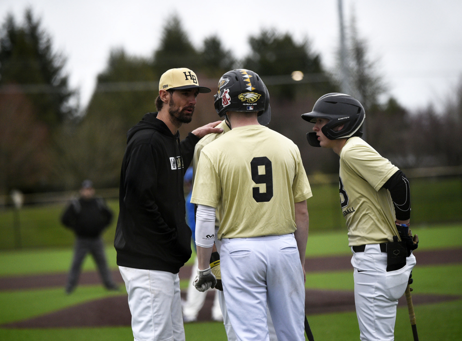 Hudson?s Bay coach Greg Peavey talks to his players during a break in the action in a 2A Greater St. Helens League baseball game in Ridgefield on Monday, March 27, 2023.