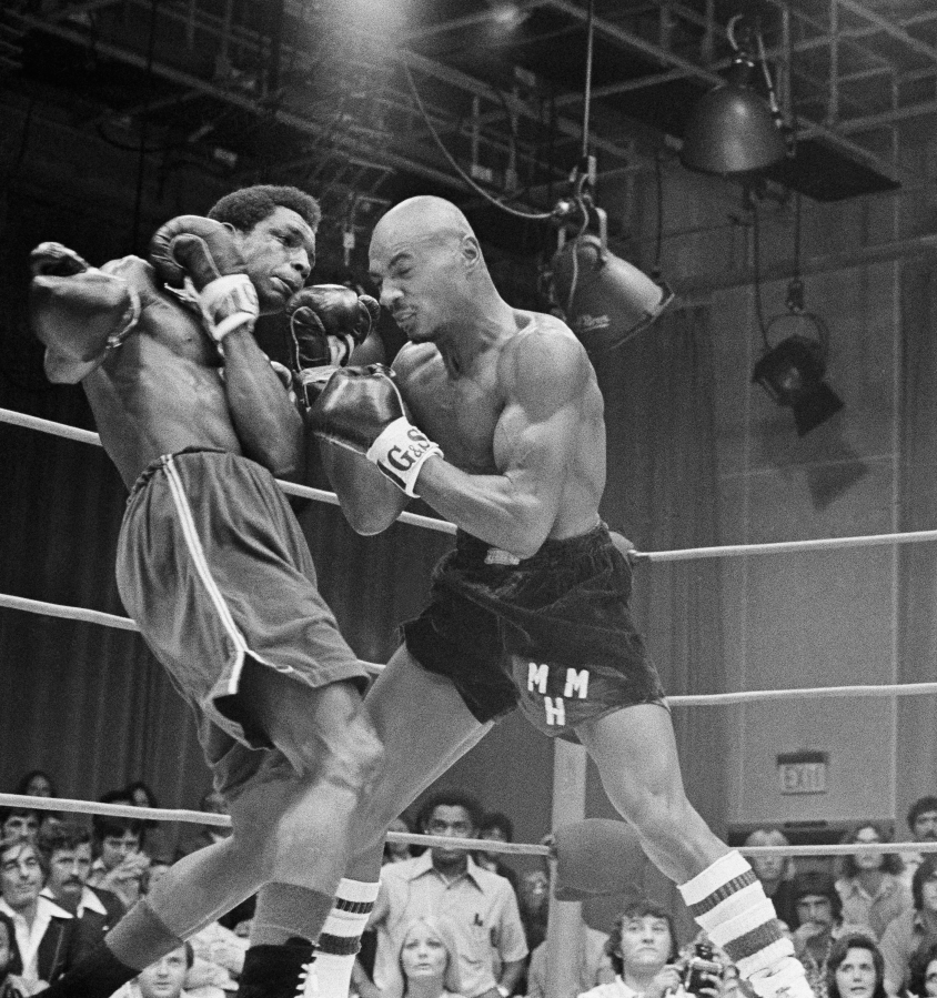 Marvin Hagler of Brockton, Mass., right, gets in close with Sugar Ray Seales of Tacoma, Wash., during a match in Boston, Aug. 31, 1974. Hagler, the unbeaten 1973 National AAU Champion, won an easy decision in the 10-round bout against Seales, the 1973 Olympic Gold Medal winner.