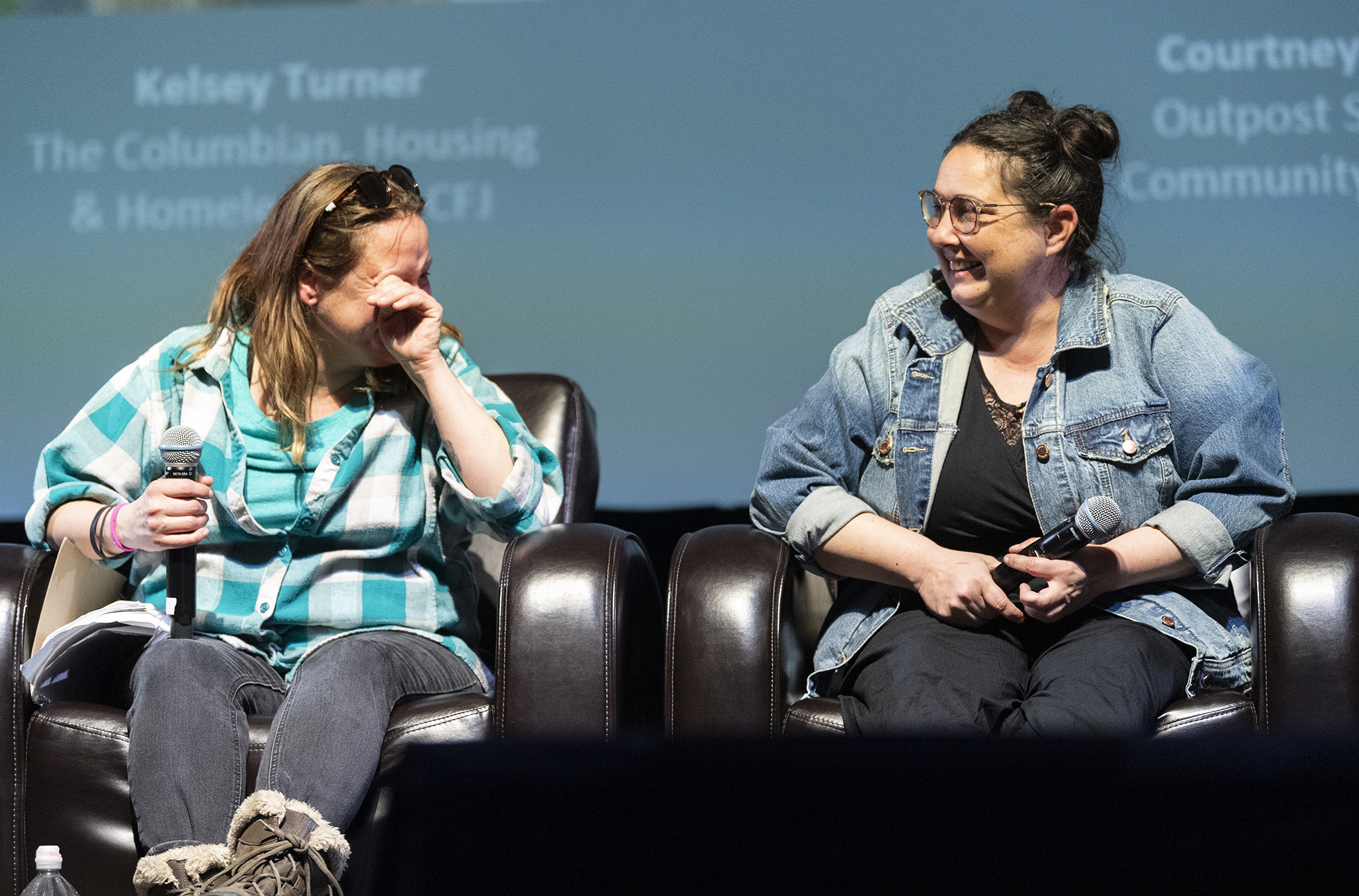 Outpost Safe Stay resident Courtney Ligman, left, chokes up thinking about the help she has received from City of Vancouver homelessness response coordinator Jamie Spinelli, right, and others on Wednesday, March 1, 2023, during The Columbian Conversations event at Kiggins Theatre.