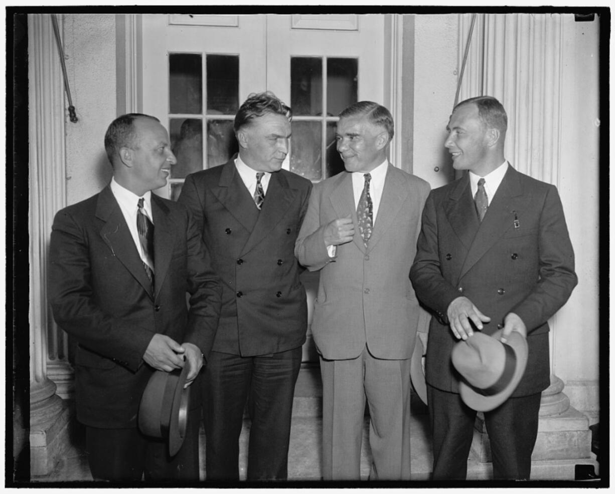 The Soviet ANT-25 transpolar flight crew, navigator Alexander Belyakov, left, pilot Valery Chkalov and co-pilot Georgi Baidukov, wait in the White House with an unknown man in 1937. Portland’s Meier & Frank department store owner exchanged three new suits with them, gaining a fur-lined flying suit for his window display. However, the Soviets declined to part with their long underwear.