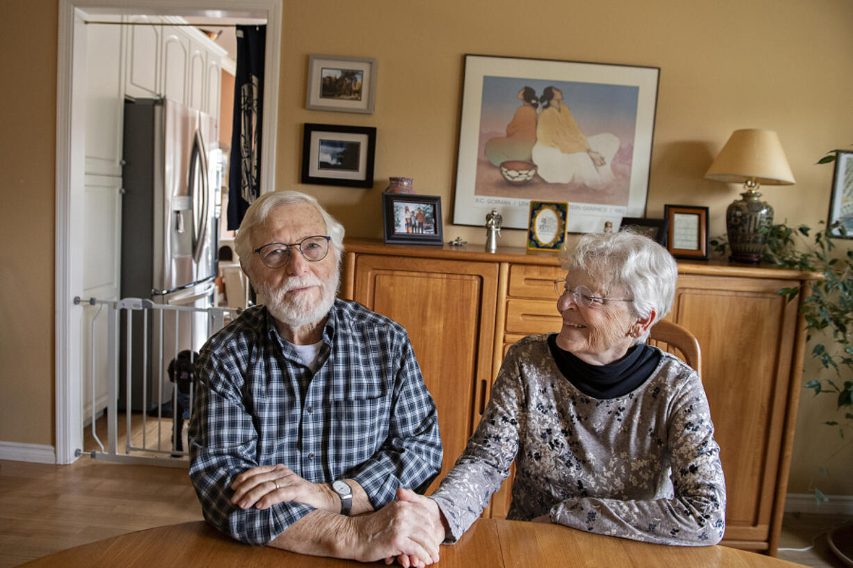 Roswell Gordon, left, and his wife, Marilynn, sit in their Vancouver home, reminiscing on their 65-plus years together. Roswell, who was diagnosed with Alzheimer's disease in 2014, was part of a trial of the drug lecanemab at OHSU from 2016-2020 and is showing signs of success.