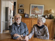 Roswell Gordon, left, and his wife, Marilynn, sit in their Vancouver home, reminiscing on their 65-plus years together. Roswell, who was diagnosed with Alzheimer's disease in 2014, was part of a trial of the drug lecanemab at OHSU from 2016-2020 and is showing signs of success.