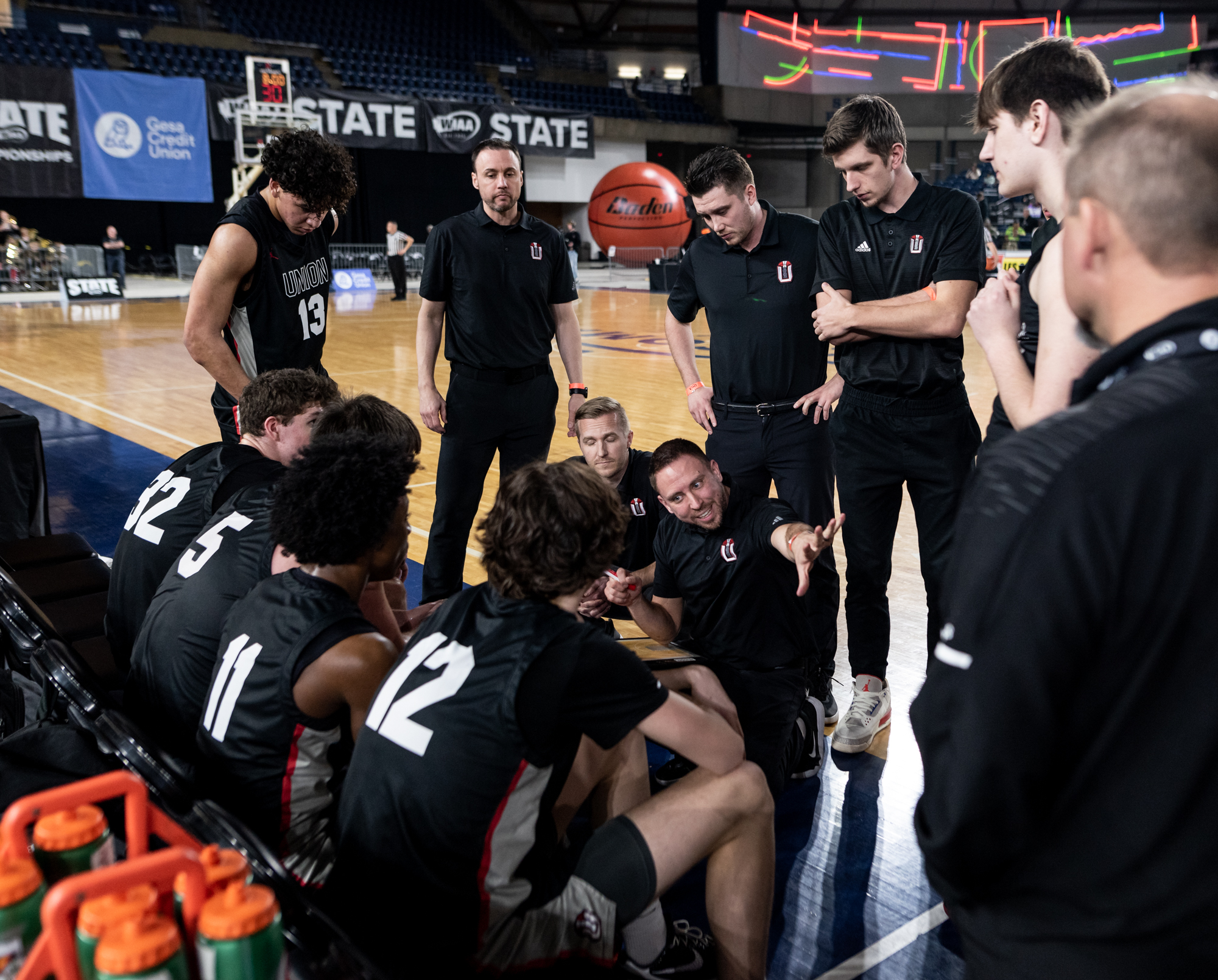 Union coach Blake Conley issues direction during a timeout during a Class 4A State boys basketball game on Wednesday, March 1, 2023, at the Tacoma Dome.