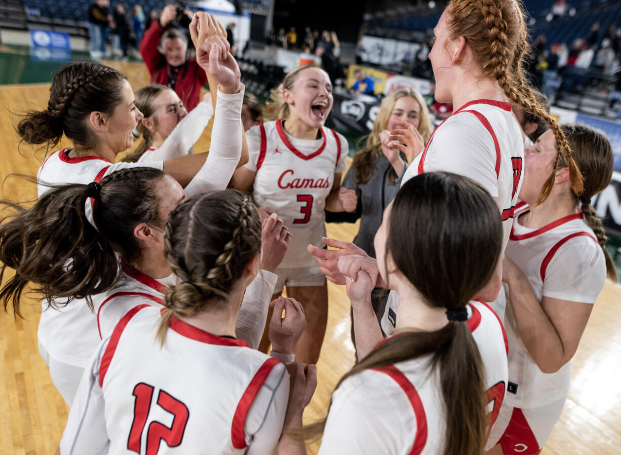 Camas celebrates its victory in a Class 4A State girls basketball semifinal on Friday, March 3, 2023, at the Tacoma Dome.