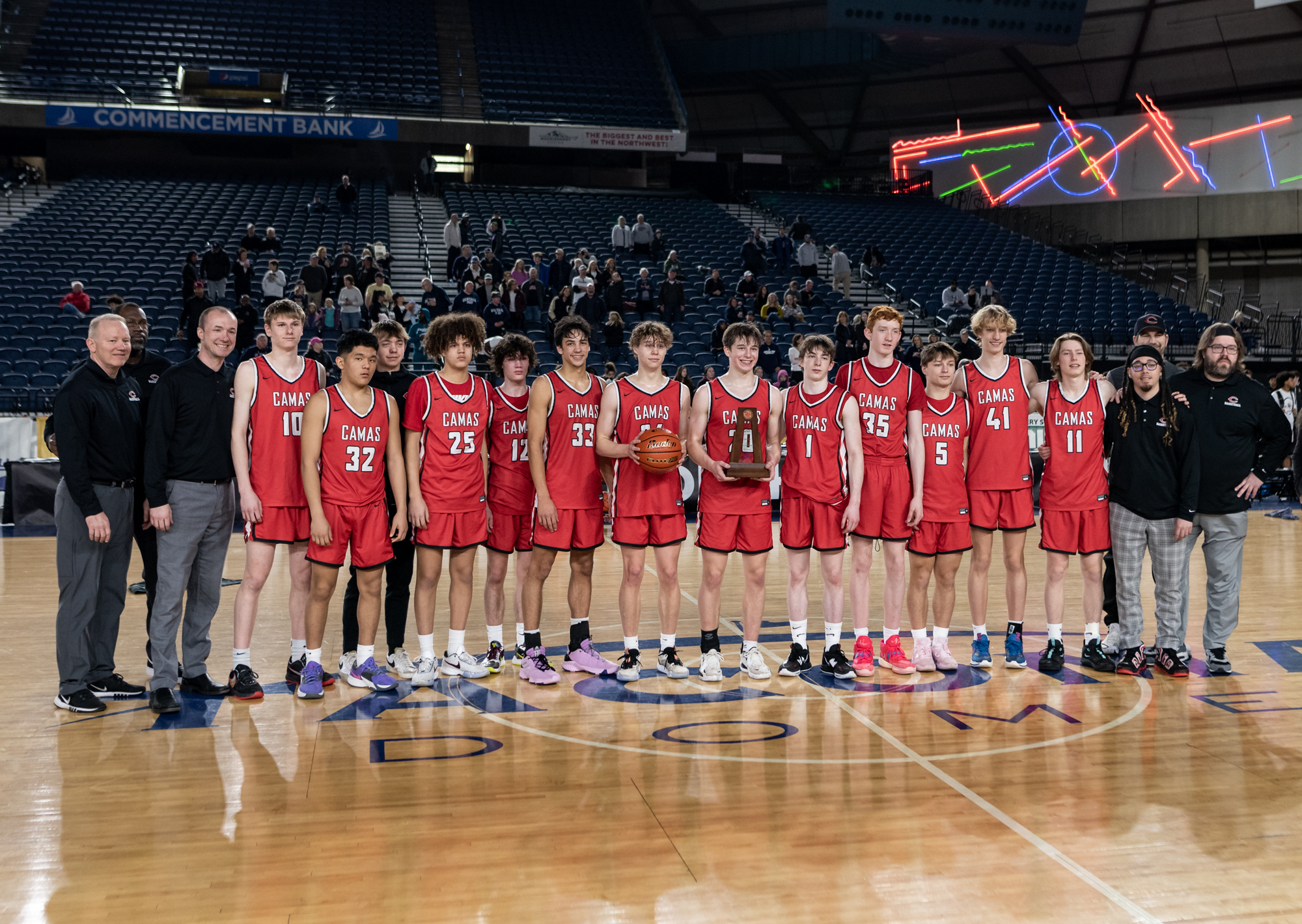Camas poses with its sixth-place trophy after a Class 4A State boys basketball trophy game on Saturday, March 4, 2023, at the Tacoma Dome.