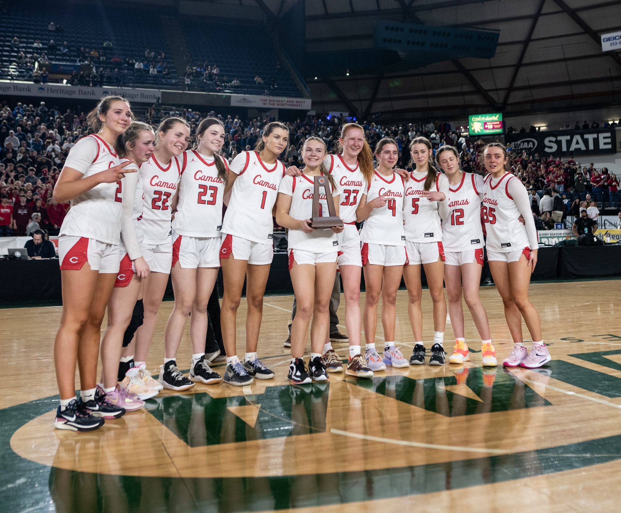 Camas poses with its second-place trophy after the WIAA Class 4A State Girls Basketball Championship on Saturday, March 4, 2023, at the Tacoma Dome.