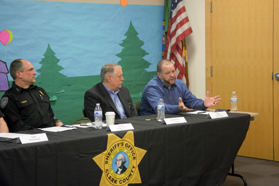 Clark County sheriff's Chief Civil Deputy Duncan Hoss, right, gives an update on the agency's body-worn camera program. Sheriff's office administrators discussed the agency's camera program and staffing, as well as police reform legislation, with community members at a forum Wednesday evening at the Three Creeks Community Library in Salmon Creek.
