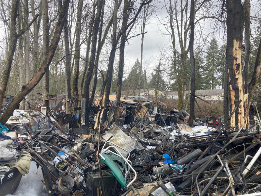 Scorched belongings remain at The Swamps homeless encampment after a fire early Friday morning at the intersection of N.E. 107th Avenue and N.E. 53rd Street in Vancouver's North Image neighborhood.